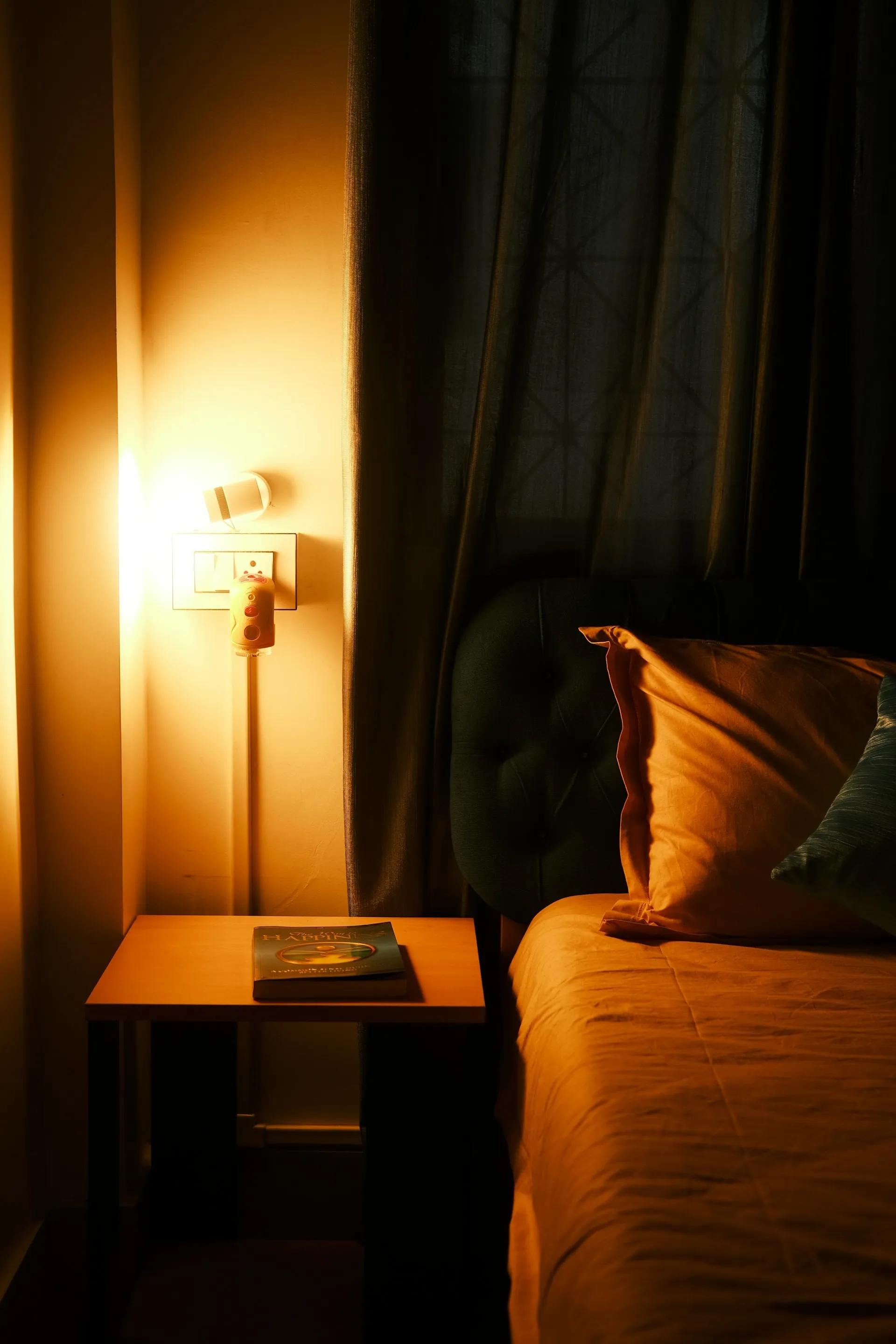 Sunset lamp projecting warm color onto a bedroom wall