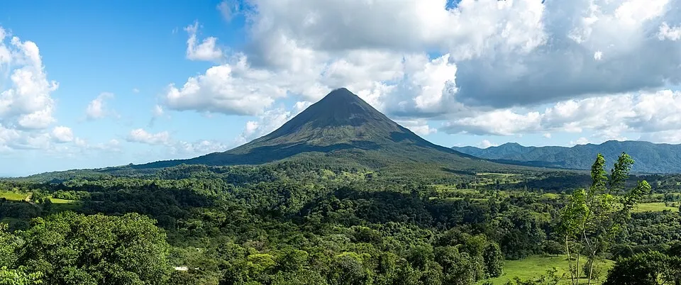 Arenal Volcano reflected in the lake - the conical perfection that defines Costa Rica