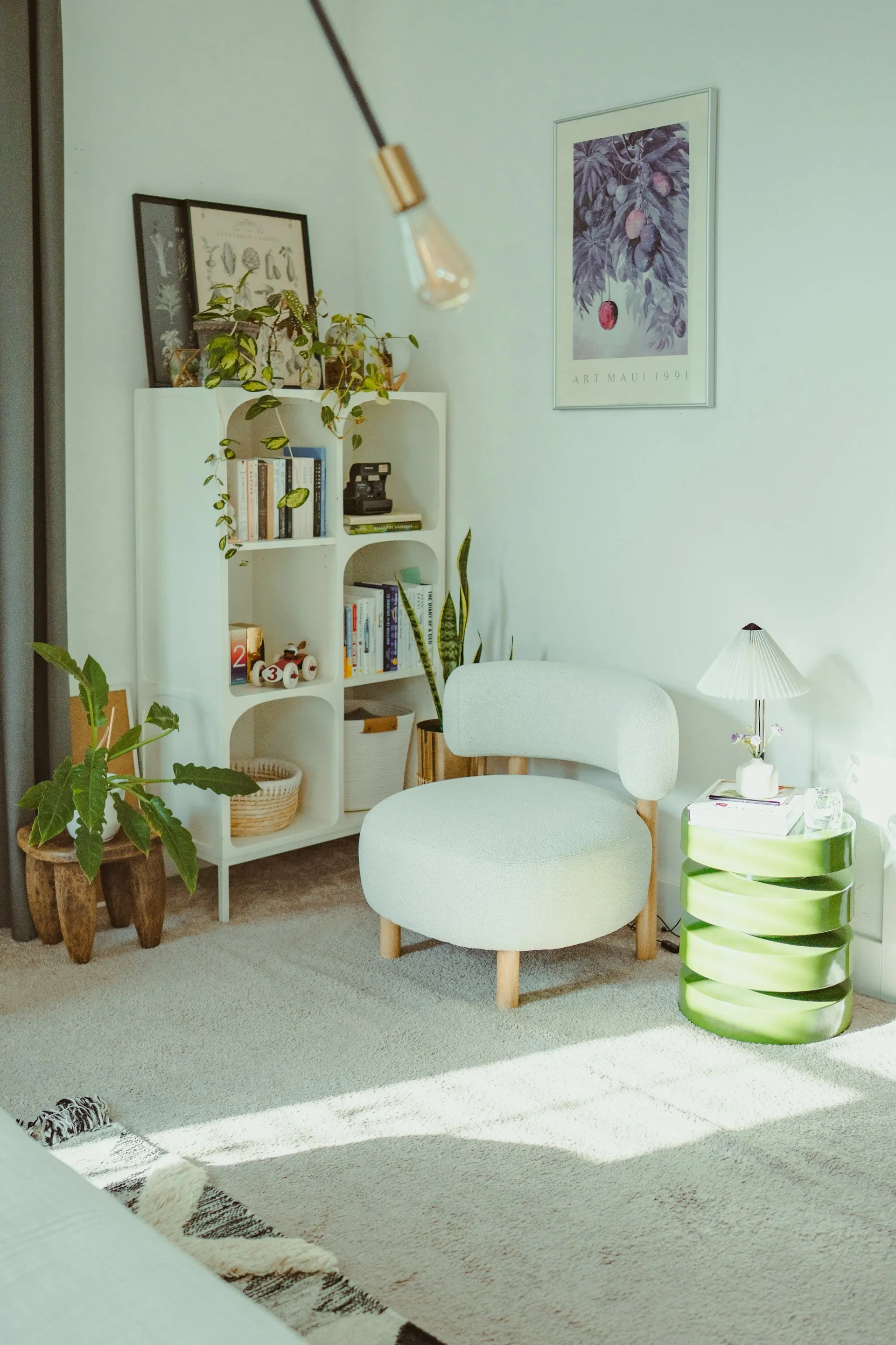 Cozy reading nook and bedroom retreat with green walls and warm light