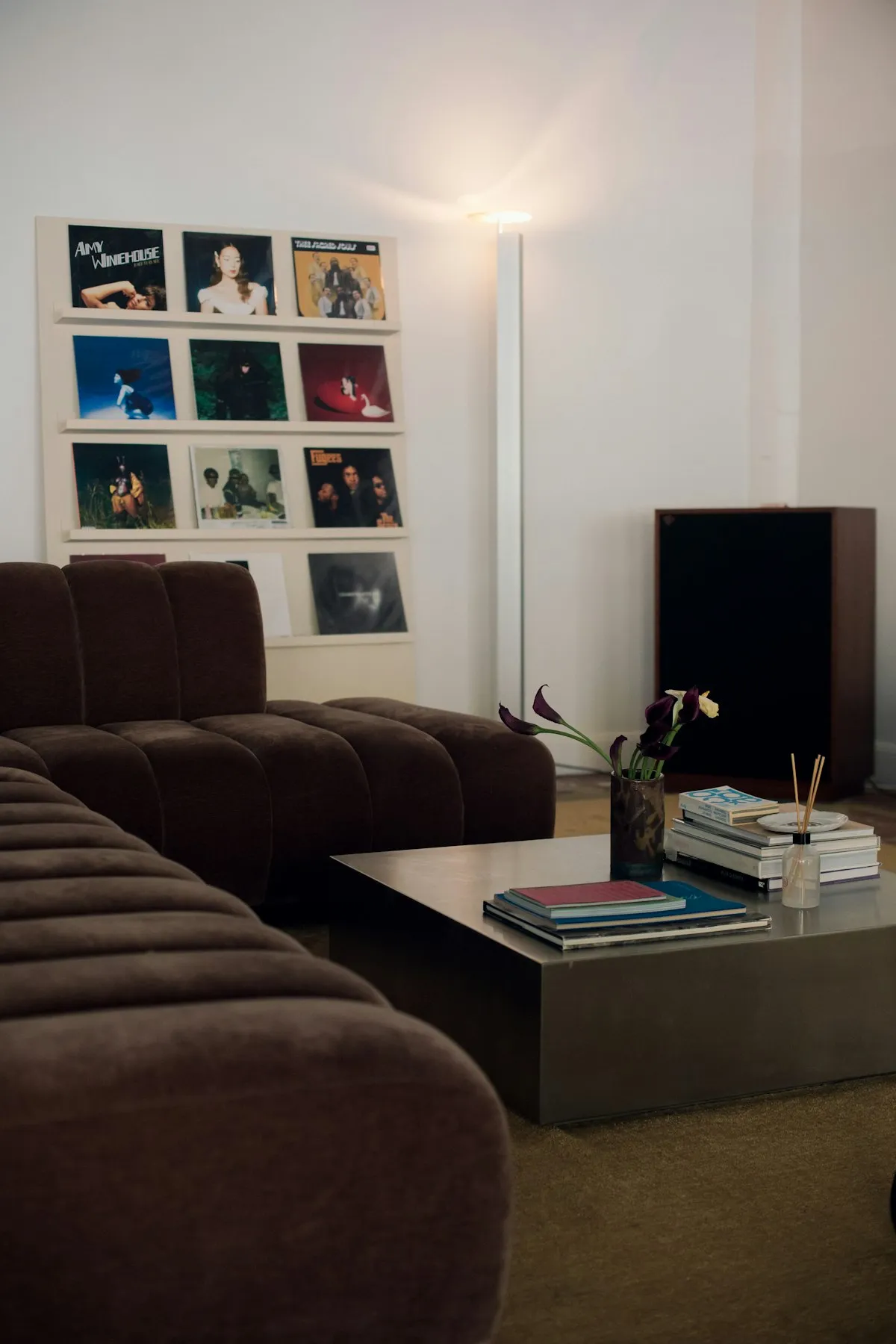 Dark chocolate brown velvet sofa in a saturated espresso interior