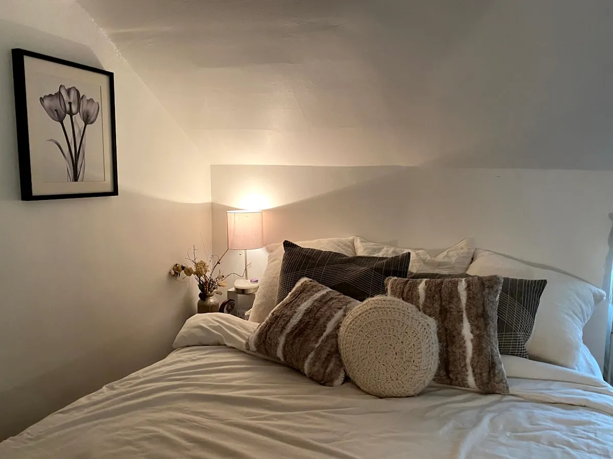 Cozy bedroom with espresso brown headboard and soft linen