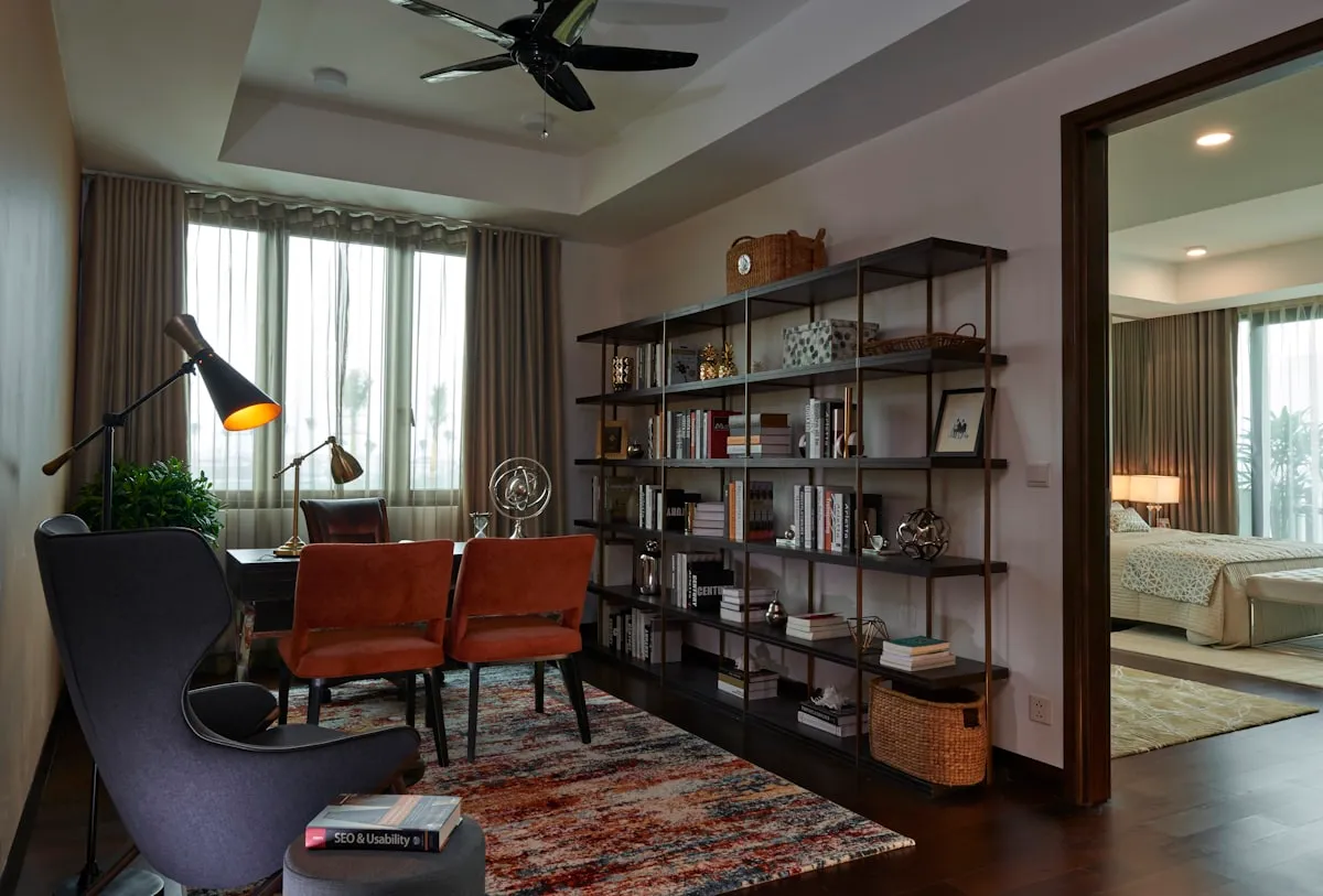 Luxury study with espresso bookshelves and a brown leather chair