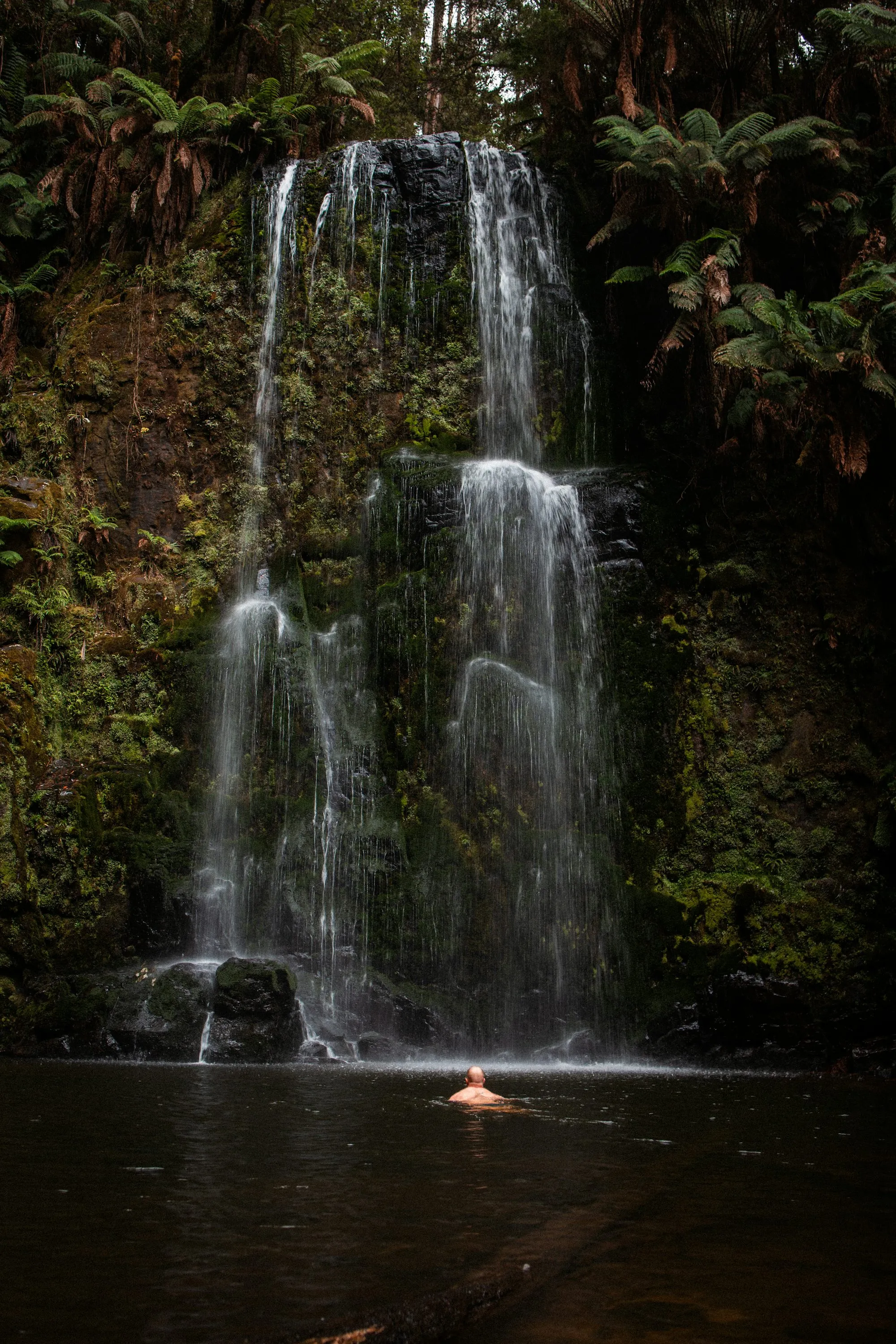 Swimming in the waterfall pool - the cool emerald water beneath La Fortuna cascade
