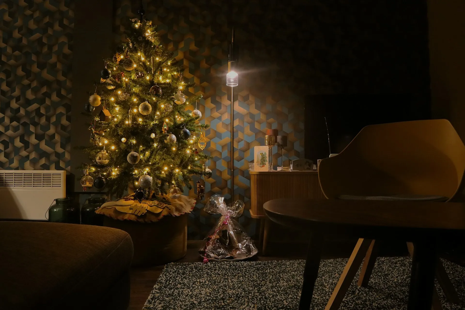 Christmas tree in a cozy living room with warm lights