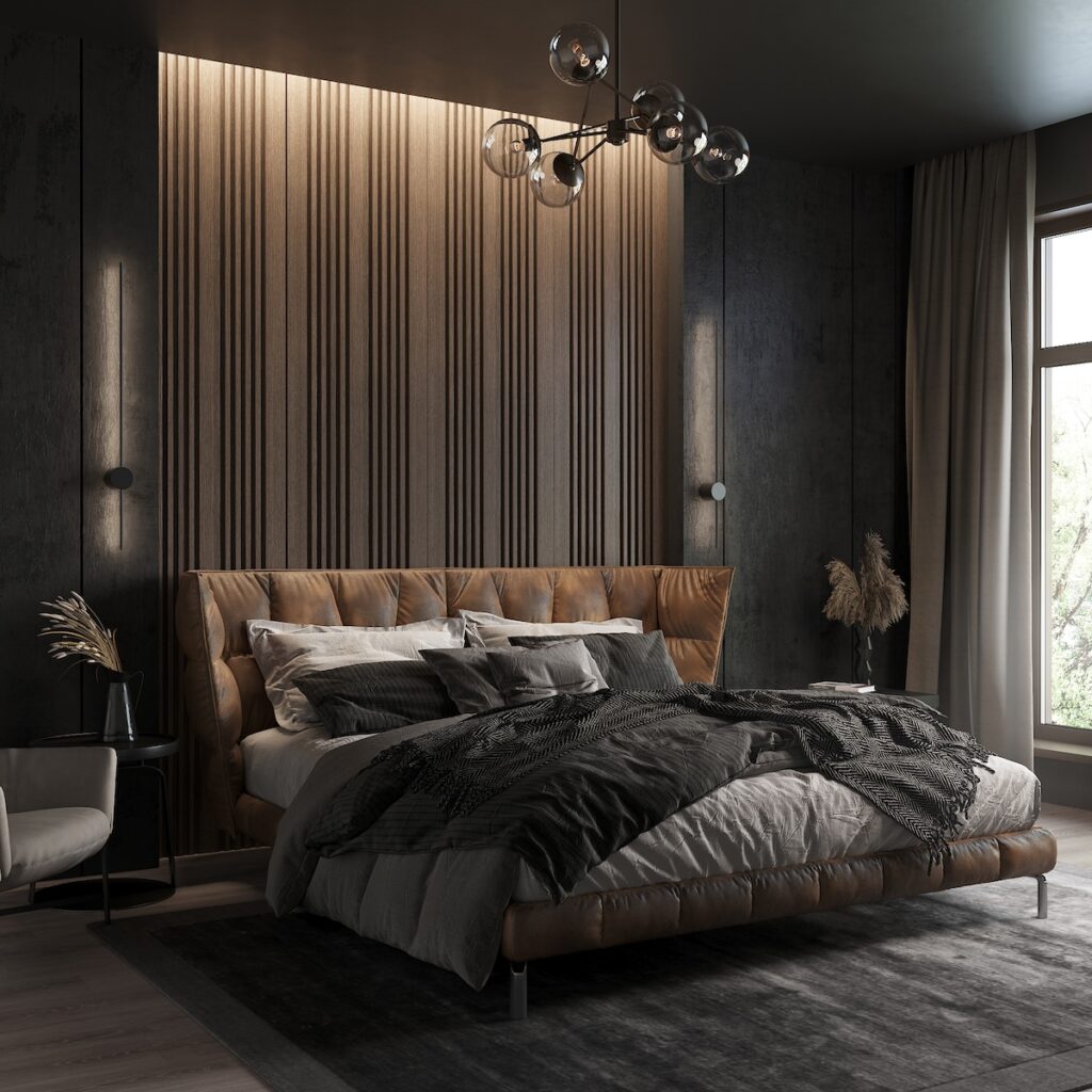 Moody luxury bedroom with black walls, brown leather bed, and gray textiles