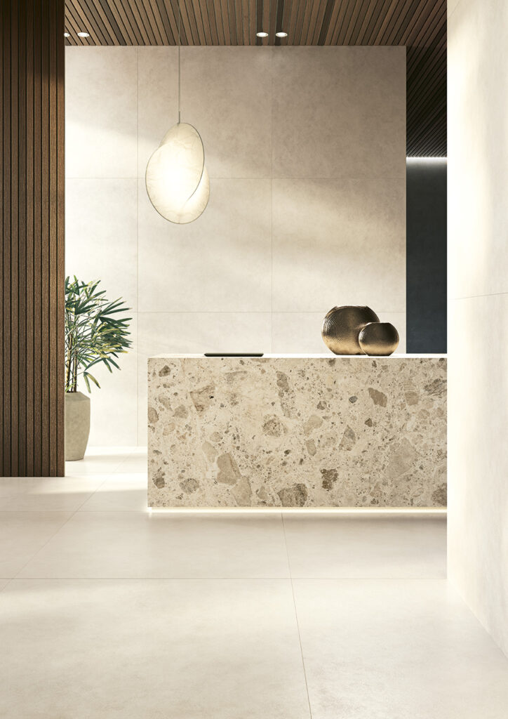 Hall interior with warm stone-surfaces and soft neutral palette