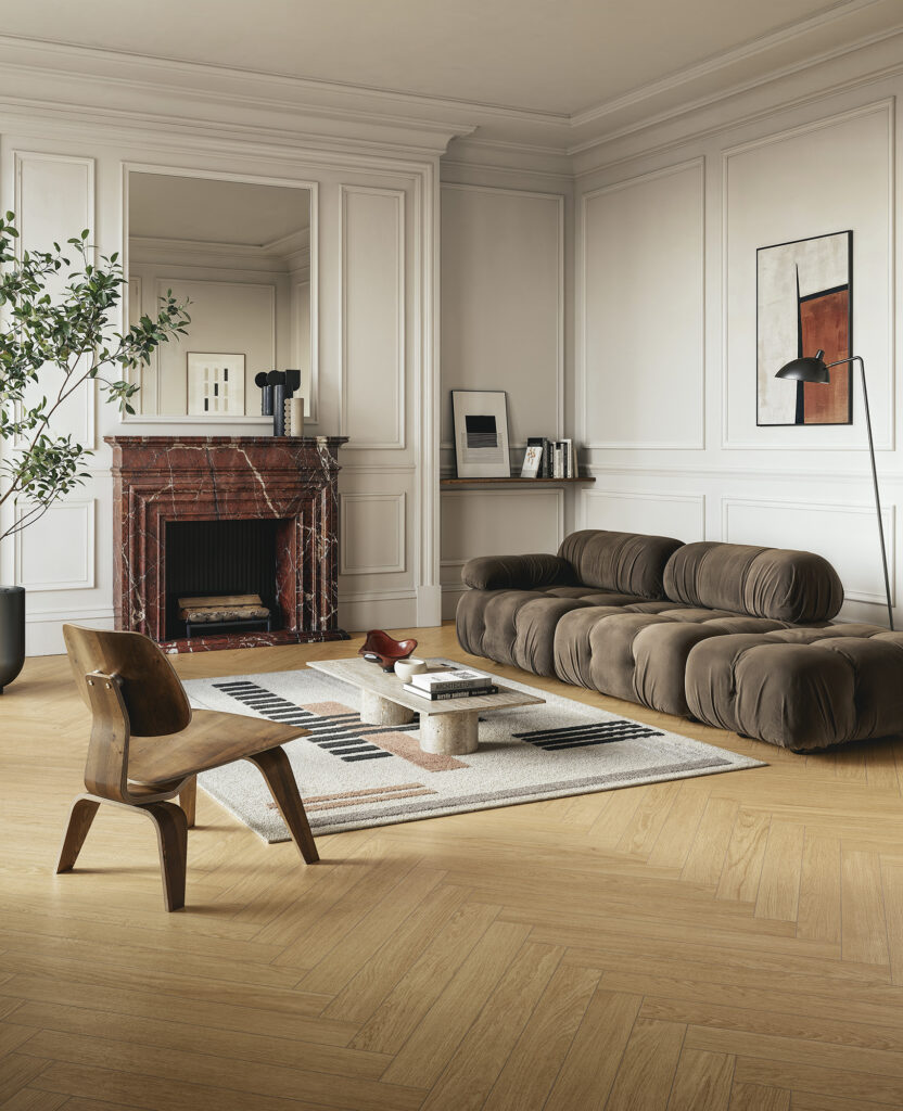 Interior with natural wood chevron flooring and warm tones