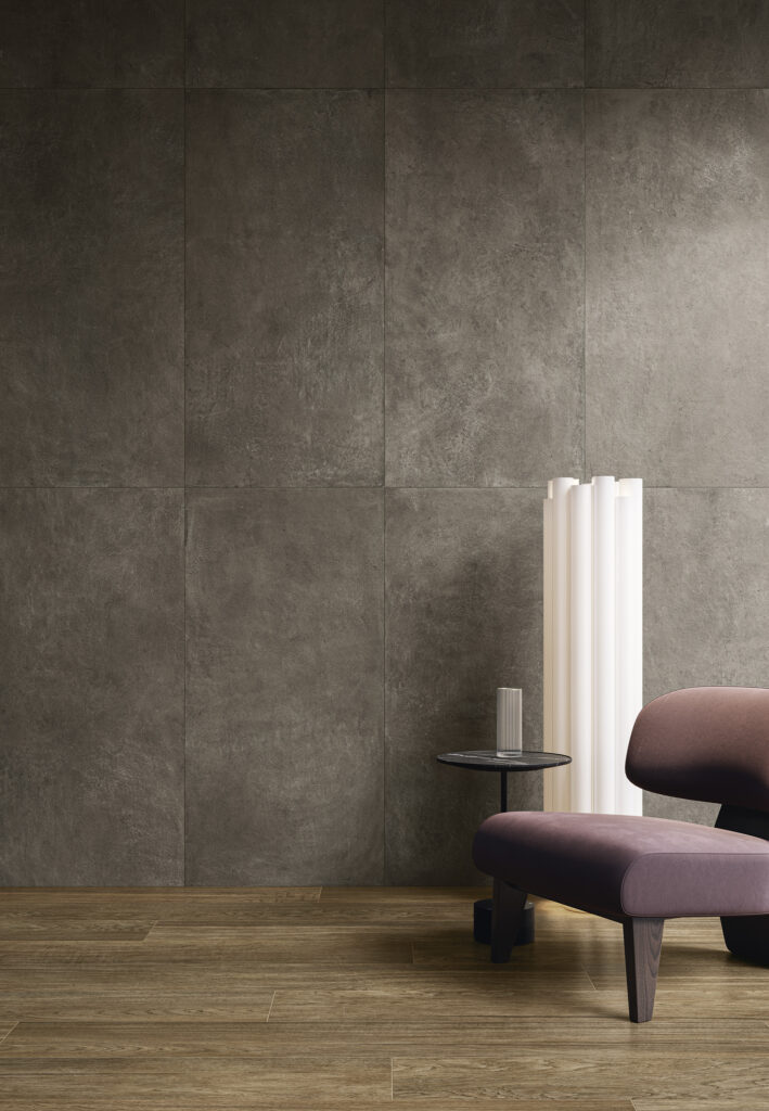 Living space with textured plaster-like surfaces in warm coffee tones