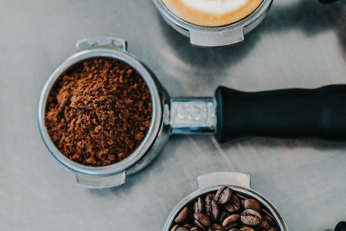 Portafilter locked in group head, first drops of espresso falling