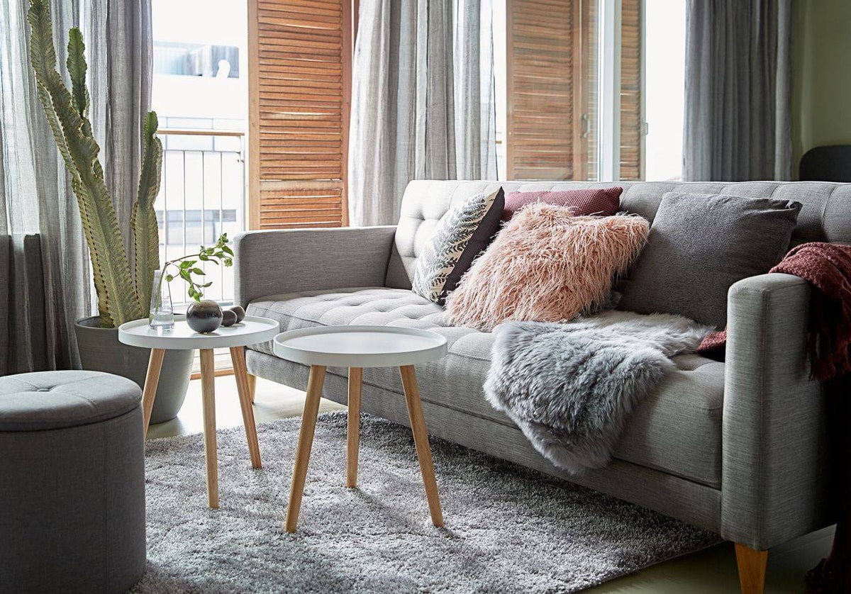 Hygge bedroom sanctuary with layered bedding and warm lighting